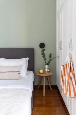 a bedroom with a bed and a table at Spacious 3-Bedroom Getaway with Balcony in Glyfada in Athens
