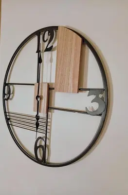 a clock hanging on a wall at Minimal Vintage διαμέρισμα στο κέντρο της Αθήνας in Athens