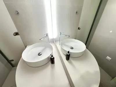 a bathroom with a white sink and a toilet at Athens 5th Floor Retreat, Blissful Escape in Athens