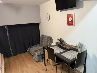 a dining room with a table and a chair at Στούντιο στο Κέντρο της Πόλης in Athens
