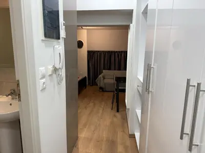a bathroom with a sink and a room with a bed at Στούντιο στο Κέντρο της Πόλης in Athens