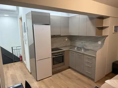 a small kitchen with a sink and a refrigerator at Στούντιο στο Κέντρο της Πόλης in Athens