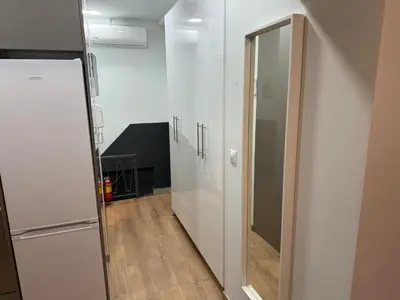 a hallway with a mirror and a white wall at Στούντιο στο Κέντρο της Πόλης in Athens