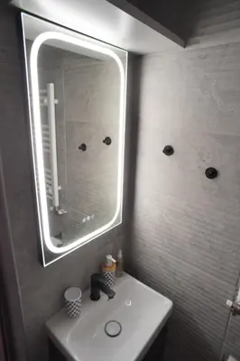 a bathroom with a sink and a mirror on the wall at The Urban Nest 2 in Athens