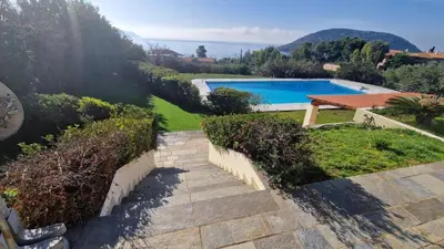 a staircase leading to a swimming pool in a yard at Villa Falmy in Anavissos