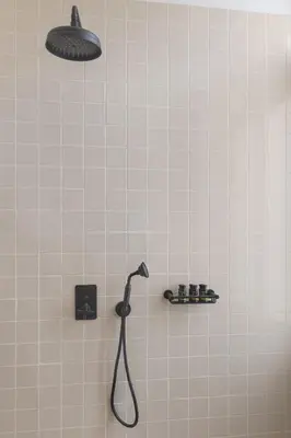 a shower with a shower head in a bathroom at Morus Acropolis Boutique Hotel in Athens