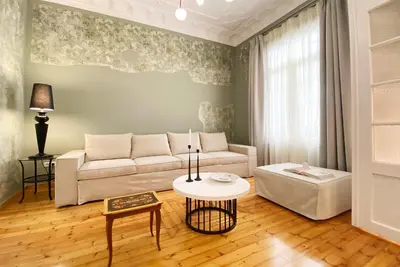 a living room with a couch and a table at Live in Athens, PANGRATI Fine Residence in Athens