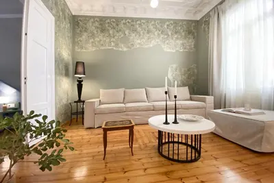 a living room with a couch and a table at Live in Athens, PANGRATI Fine Residence in Athens