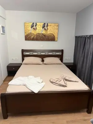 a bedroom with a bed with two towels on it at Studio in the heart of the city in Athens