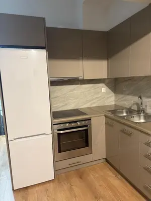 a kitchen with a white refrigerator and a sink at Studio in the heart of the city in Athens