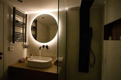 a bathroom with a sink and a mirror at Venus house apart in Pagrati in Athens