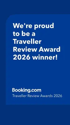 a blue sign that says were proud to be a traveller reviewagency winner at Aldi Seaside Suite in Athens