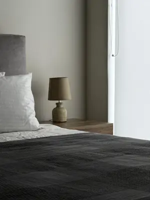 a bedroom with a bed with a lamp on a table at 1 Bedroom Cozy Studio in Athens