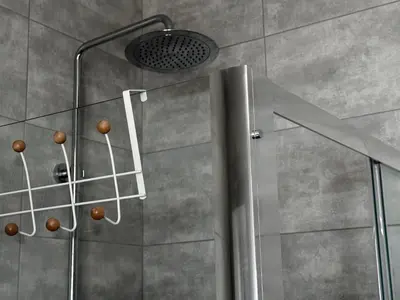 a shower with a glass door and a shower head at 1 Bedroom Cozy Studio in Athens
