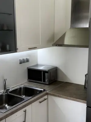 a kitchen with a sink and a microwave at 1 Bedroom Cozy Studio in Athens