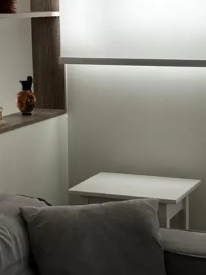 a living room with a couch and a table at 1 Bedroom Cozy Studio in Athens