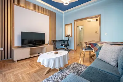 a living room with a couch and a tv at Central Spot 2-Bedroom Apt by ΜΡS in Athens