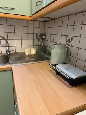 a kitchen with a counter top with a toaster at Menta Boho Piraeus Apartment in Piraeus
