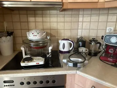 a kitchen counter with a blender on top of a stove at Saronida Beachwalk Stay in Saronida