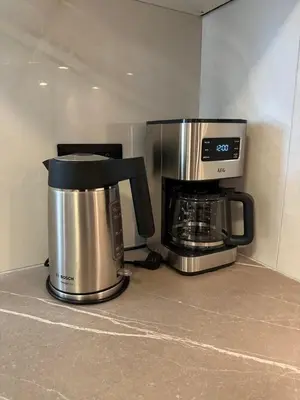 a coffeemaker and a coffee maker on a counter at Etherion Luxury Rooftop Balcony Penthouse in Athens in Athens