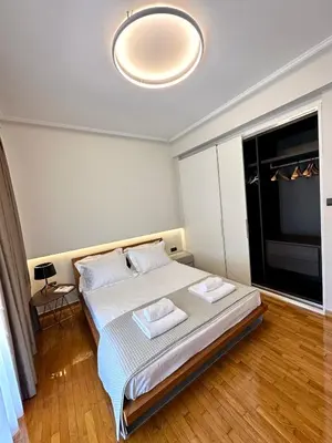 a bedroom with a large bed and a large window at Etherion Luxury Rooftop Balcony Penthouse in Athens in Athens