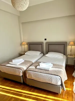 two beds sitting next to each other in a room at Etherion Luxury Rooftop Balcony Penthouse in Athens in Athens