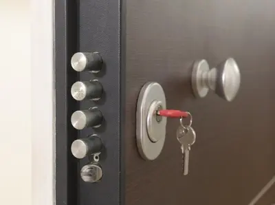 a door with a key sticking out of it at Cozy 6th floor, city center, 30m2, sun terrace in Athens