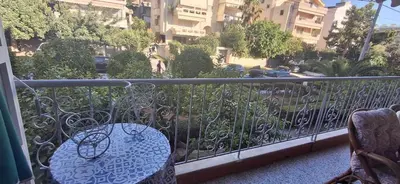 a balcony with a bench and a view of a city at Glyfada31 near center in Athens
