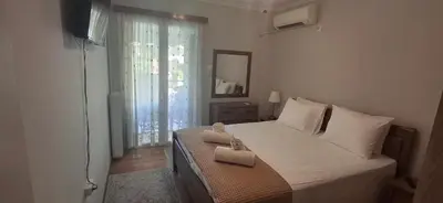 a bedroom with a bed with two towels on it at Glyfada31 near center in Athens