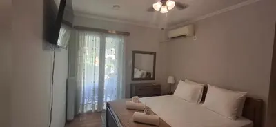 a bedroom with a bed with two towels on it at Glyfada31 near center in Athens