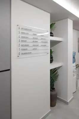 a kitchen with white walls and a white refrigerator at Shiny Santorini Apartment in Piraeus