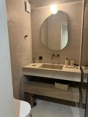 a bathroom with a sink and a mirror at Coastal Charm by Neuvel in Athens