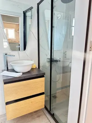 a bathroom with a sink and a shower at Rooftop in Psyrri- 360 Athens view in Athens