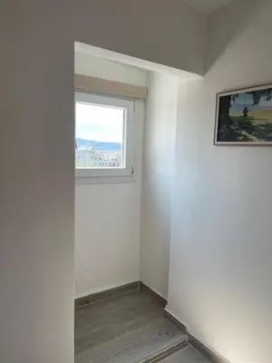 a room with a window and a white wall at Rooftop in Psyrri- 360 Athens view in Athens