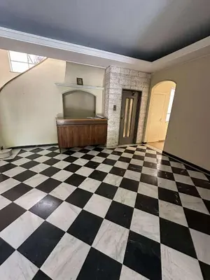 an empty room with a checkered floor and a piano at The Athenian Spot in Athens