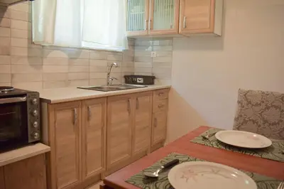 a kitchen with a sink and a plate on a table at Sofia's Urban Flat - Near Tram in Athens