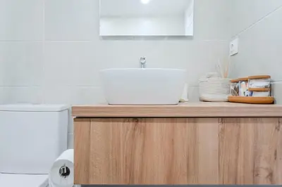 a bathroom with a sink and a toilet at Sefis apartment in Athens