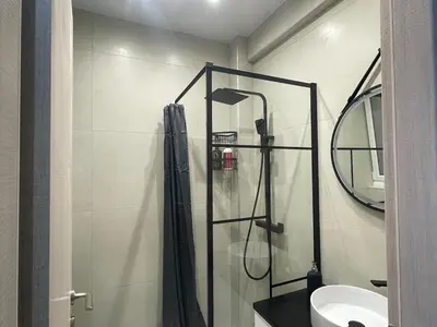 a bathroom with a shower and a sink at Chris375flat-ParkOperaOnasioRea in Athens