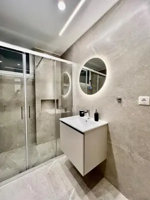 a bathroom with a sink and a shower at Home in Piraeus in Piraeus