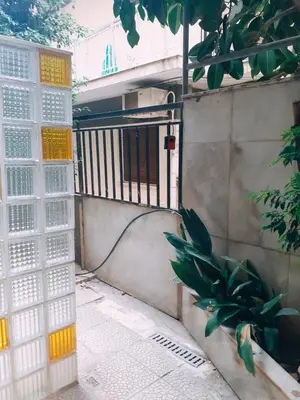 an entrance to a building with a gate at \u96c5\u5178\u6d77\u6ee8\u516c\u5bd3 in Athens