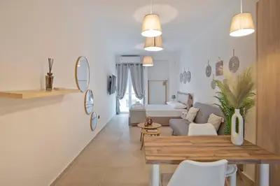 a living room with a couch and a table at Silia Spotless Fully Renovated Studio in Athens
