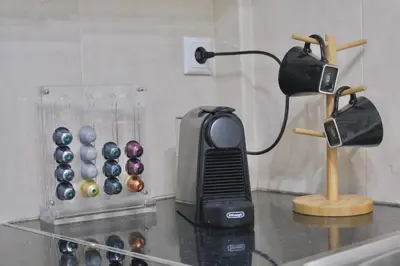 a blow dryer on a counter next to an abacus at Luxury varkiza apartment in Vari