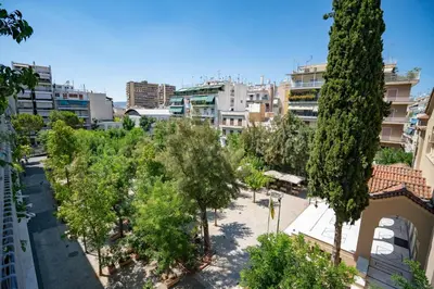 a view of a city with trees and buildings at Athens Central Charm by ΜΡS in Athens