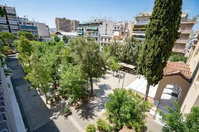 an overhead view of a park with trees and buildings at Athens Central Charm by ΜΡS in Athens