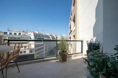 an apartment balcony with a view of a city at Athens Central Skyline Studio by ΜΡS in Athens