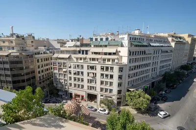 an overhead view of a large white building at Athens Central Skyline Studio by ΜΡS in Athens