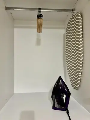 a black phone sitting on a shelf in a room at Athenian Loft with urban view! in Athens
