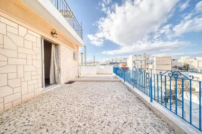 a balcony with a view of the city at Acropolis View - Cozy Studio 4 Metro Neos Kosmos in Athens