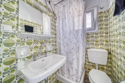 a bathroom with a sink and a toilet at Acropolis View - Cozy Studio 4 Metro Neos Kosmos in Athens