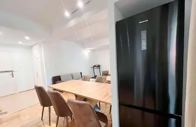 a kitchen and dining room with a table and chairs at Dafni 2Bdrm apartment in Neapoli by ΜΡS in Athens
